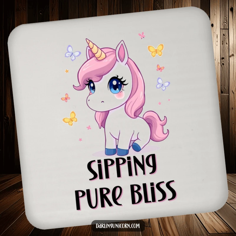 Cute drink coaster featuring a unicorn with innocent eyes watching butterflies, protecting surfaces with magical charm.