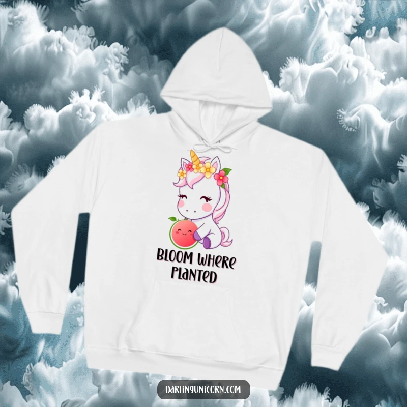 Funny hoodie featuring a cute unicorn with a floral crown, contentedly nibbling a radiant magical fruit, radiating gentle magic.