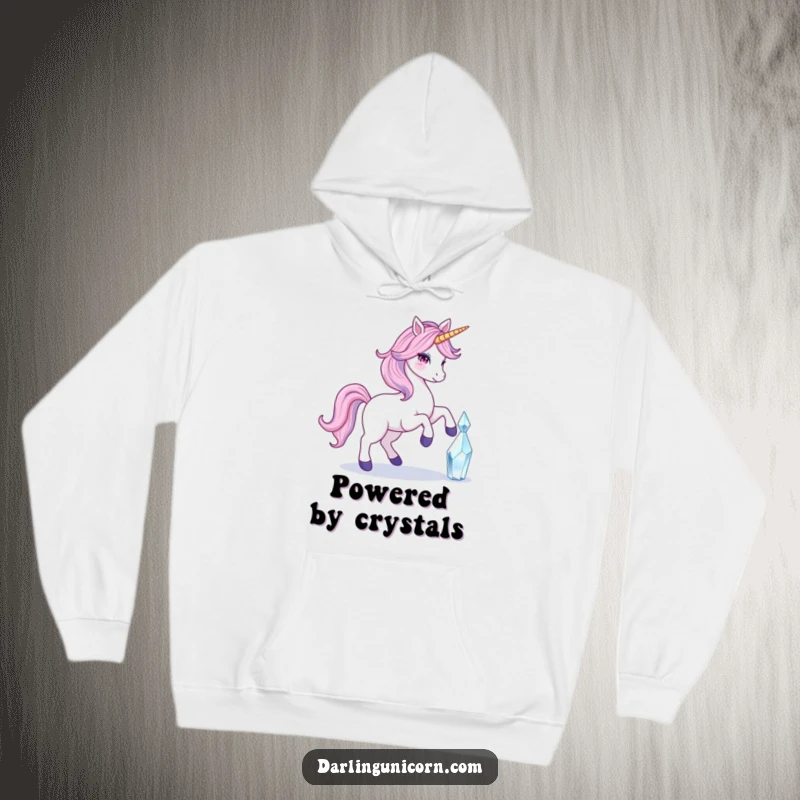 Funny hoodie featuring a unicorn with a flowing tail gracefully touching a luminous crystal, perfect for cozy, enchanting moments.
