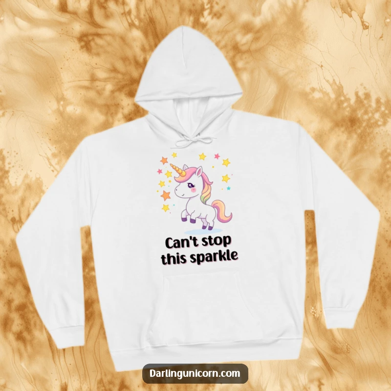 Funny hoodie featuring a unicorn juggling colorful star fragments with its horn, offering warmth and a touch of playful magic.
