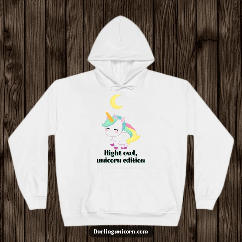 Funny Unicorn Hoodie: A calm unicorn gazes serenely at a crescent moon, offering cozy comfort.