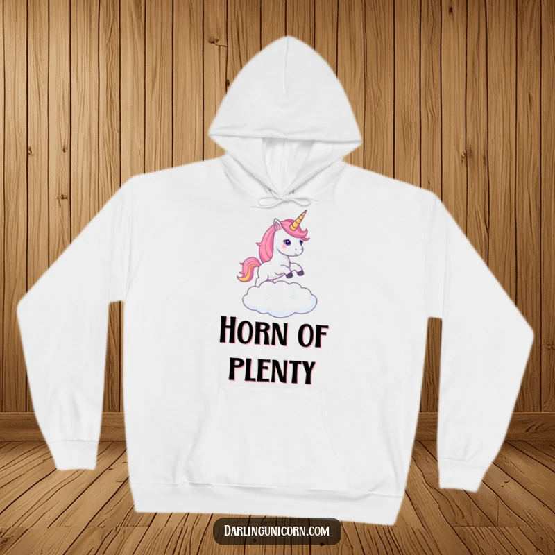 Funny hoodie depicting a unicorn with a glowing shimmering horn gracefully leaping over a cloud, radiating mystical energy.
