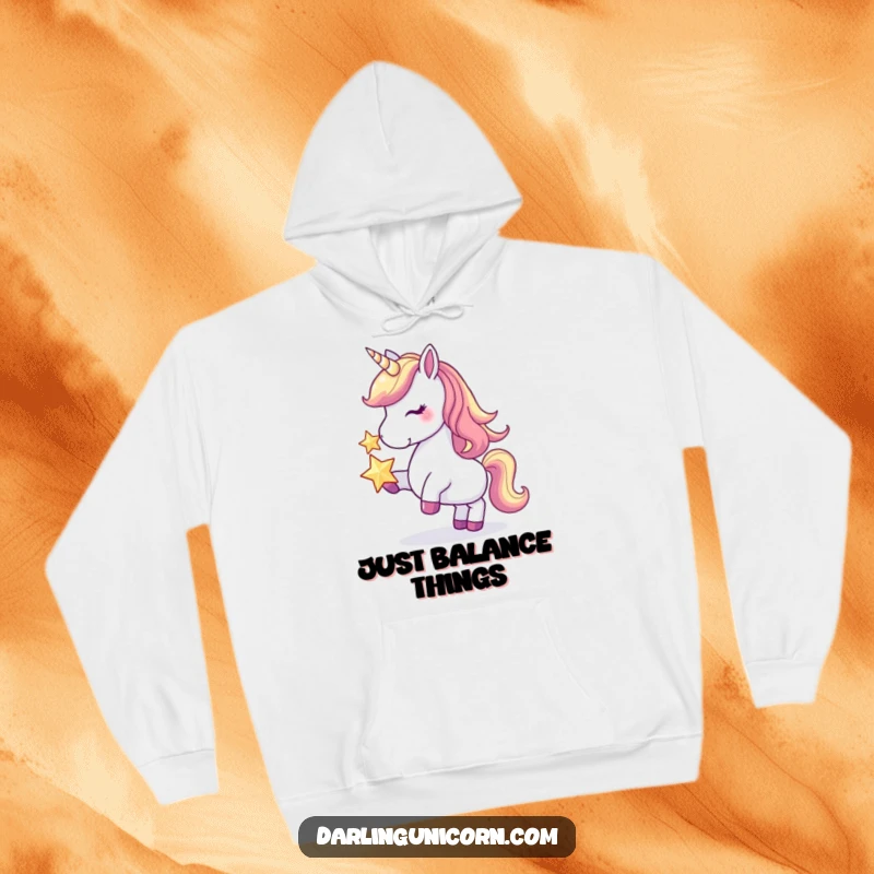 Funny hoodie featuring a majestic unicorn with remarkable balance, proudly displaying a shimmering star on its nose, ideal for cozy humor.
