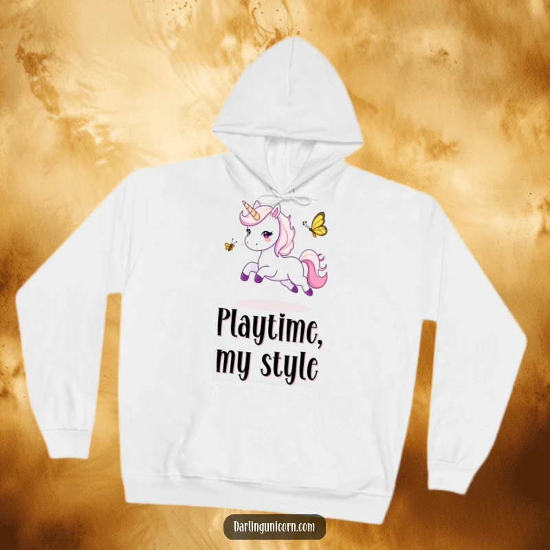 Funny hoodie showing a happy unicorn leaping playfully while engaged in a game of tag with a small, energetic butterfly.