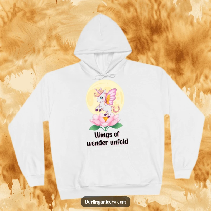Funny hoodie featuring a unicorn with butterfly wings gently landing on a blooming moonflower, perfect for cozy and magical moments.