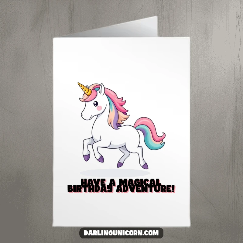 Magical Free Printable Birthday Card: A majestic unicorn prances, leaving a vibrant rainbow trail behind its hooves, wishing happy birthday.