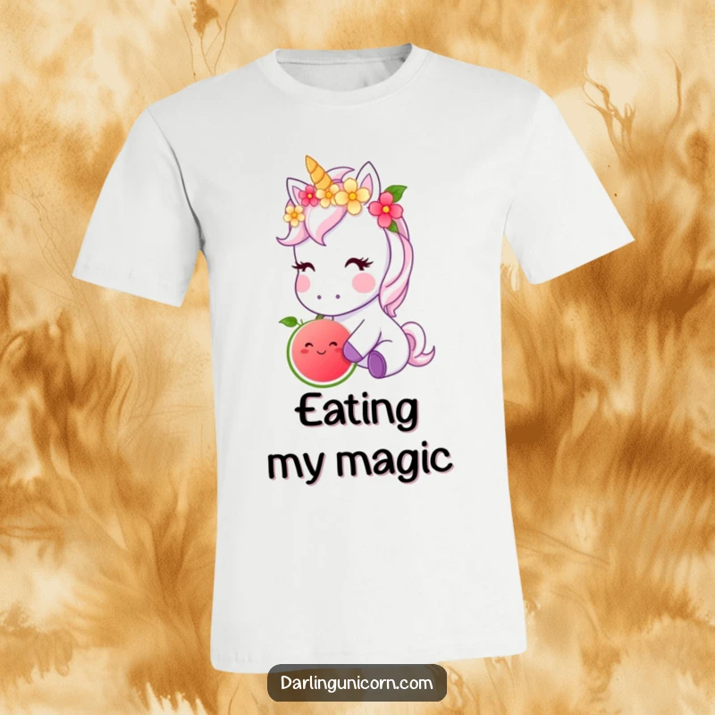 Funny t-shirt depicting a cute unicorn adorned with a flower crown, gently nibbling a luminous magical fruit, exuding charm.