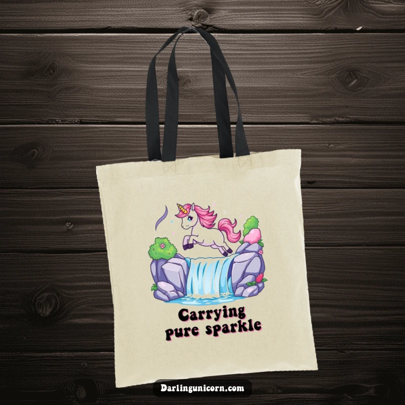 Funny tote bag illustrating a unicorn joyfully leaping over a luminous waterfall, perfect for carrying magical treasures.